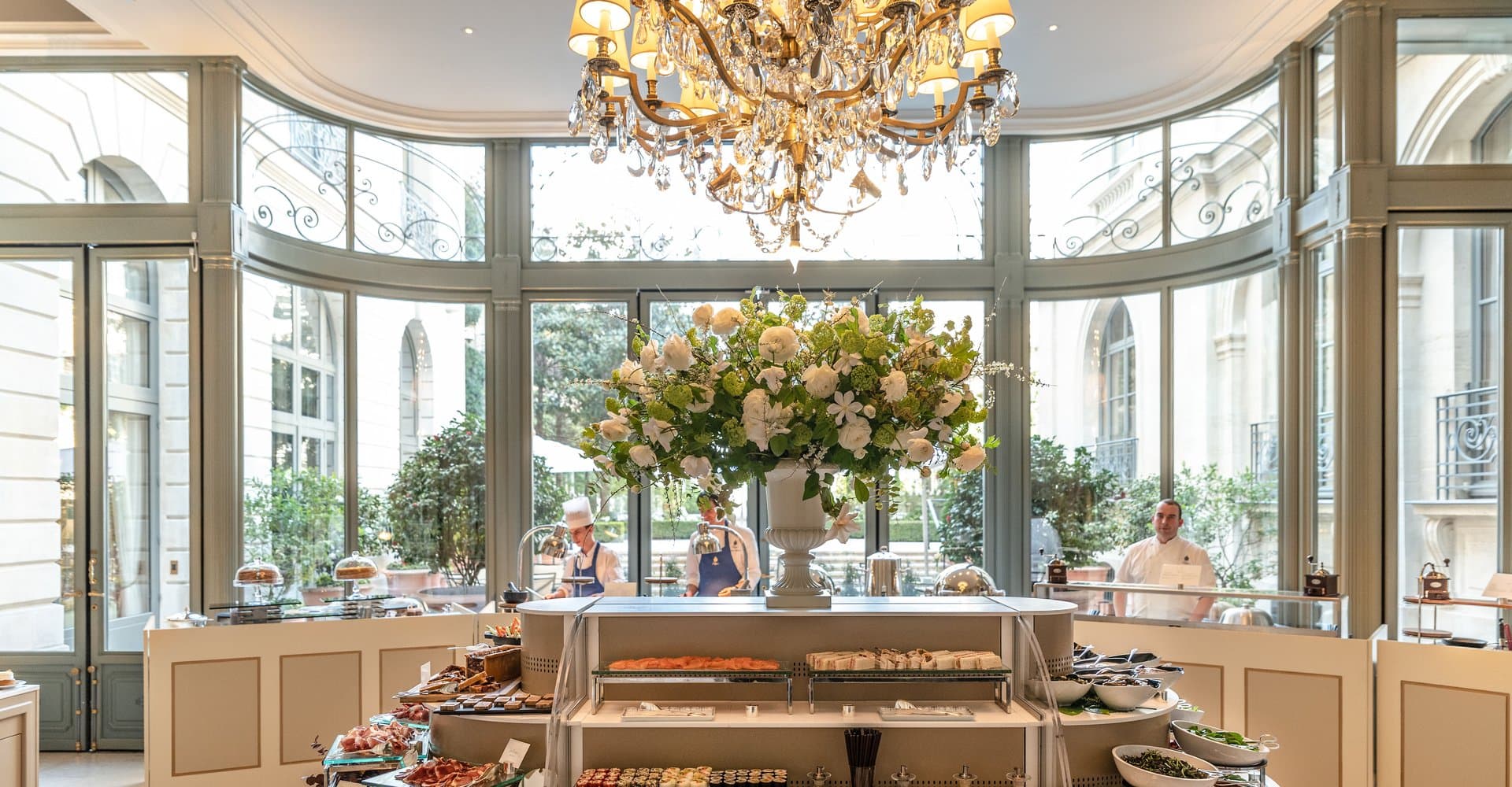 Luxury hotel breakfast room with natural light pastries fruit spread — search: luxury hotel breakfast room natural light pastries buffet spread 5 star