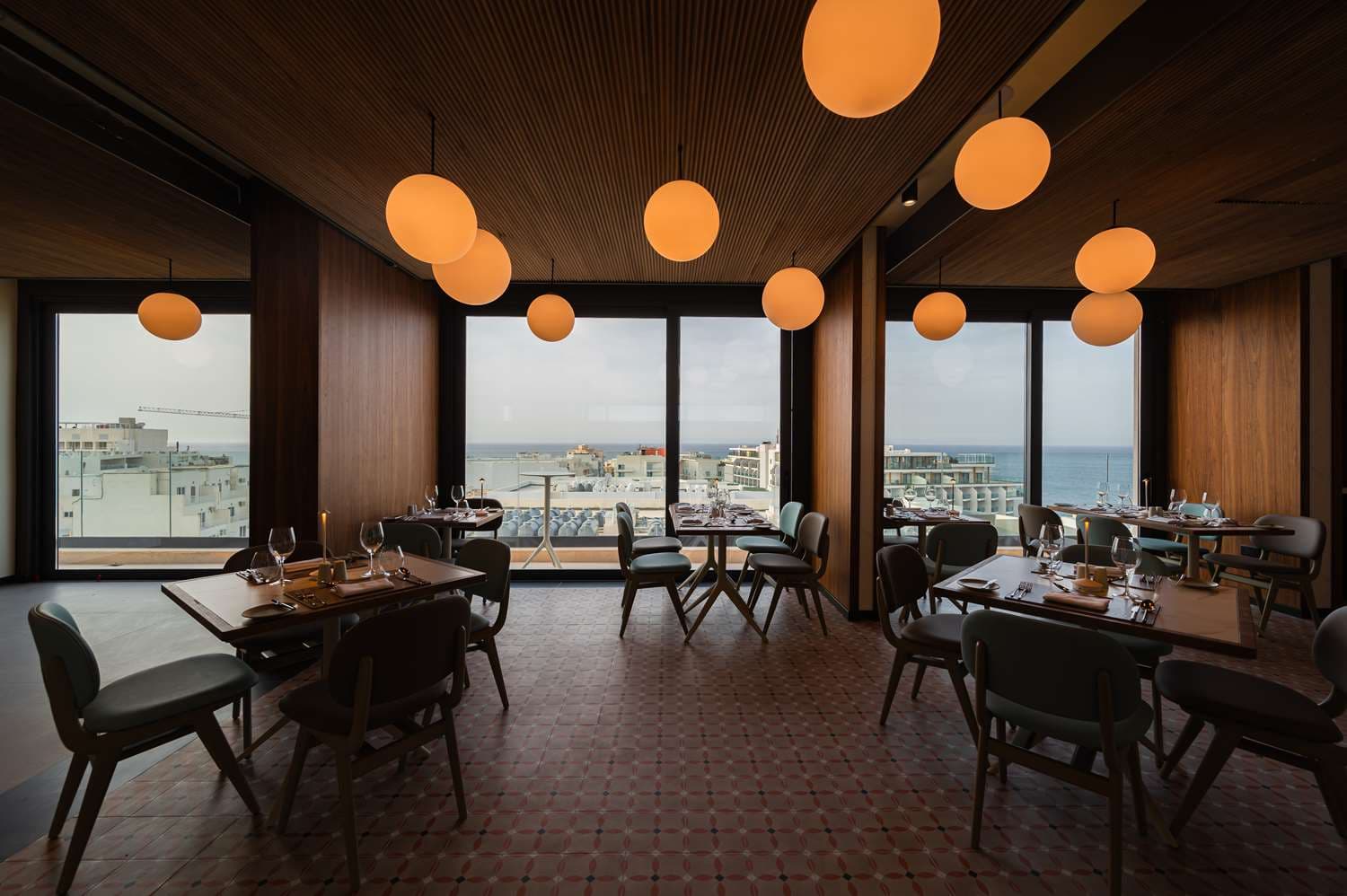 Hotel terrace restaurant sunset sea view candlelight Malta — search: hotel terrace restaurant sunset sea view candlelight evening Malta