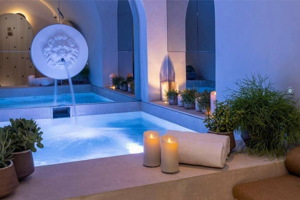 Luxury hotel spa with candles dim light water features serene atmosphere — search: luxury hotel spa candles dim light water feature serene atmosphere 5 star